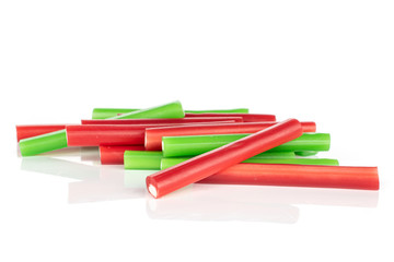 Lot of whole disordered sweet stick candy isolated on white background