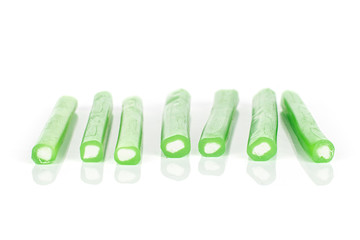 Group of seven whole sweet stick candy isolated on white background