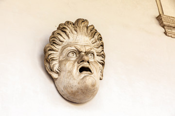 Stone mask on wall