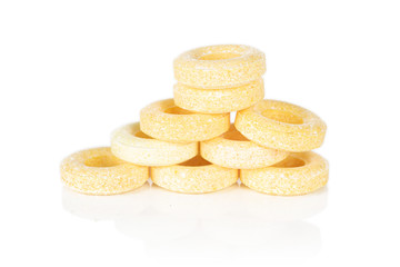 Fototapeta na wymiar Group of nine whole round pale yellow candy isolated on white background