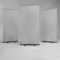 Roll up banner isolated on white background. 3D Render display mockup for presentation or exhibition product. Vertical blank roll up stand template.