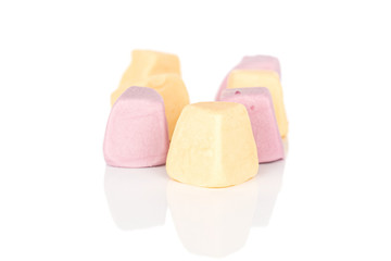 Group of six whole soft pastel candy isolated on white background