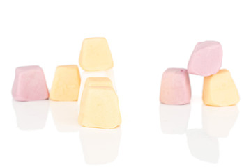 Lot of whole arranged soft pastel candy isolated on white background