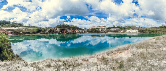 Artificial lake in kaolin mine, kaolinite - municipality of La Unión Antioquia Colombia - obrazy, fototapety, plakaty