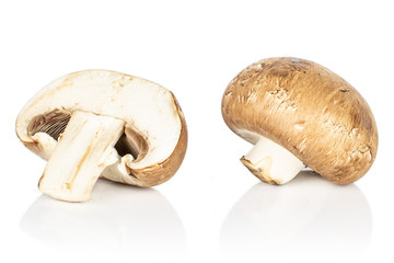 Group of one whole one half of fresh brown mushroom champignon isolated on white background