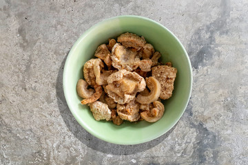 crispy pork skin on concrete table
