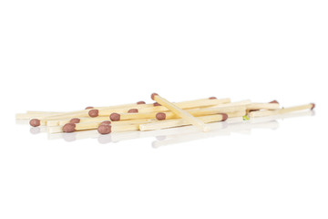 Lot of whole brown safety match front focus isolated on white background