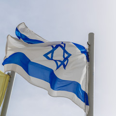 Blue and white flag of Israel at wind