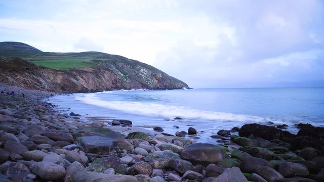 timelapse footage of the coastline in southern ireland on the dingle peninsula showing minard castle at sunset