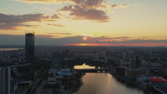 Panoramic view of sity at sunset in a warm glow.