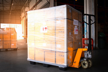 Stacked of Package Boxes on Pallets at Storage Warehouse. Shipment Boxes. Cargo Export- Import. Shipping Warehouse Logistics.