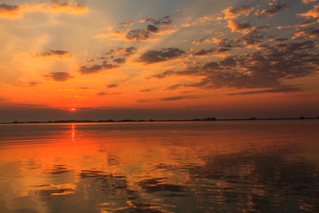 Beautiful sunrise colors and water reflections in the Danube Delta, Romania, in spring