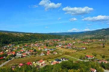 Fototapeta na wymiar landscape with a village between the hills of Transylvania