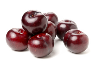 Plums on white background