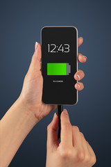 Elegant hand charging smartphone with low battery