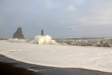 The black sand beach of Reynisfjara and the mount Reynisfjall