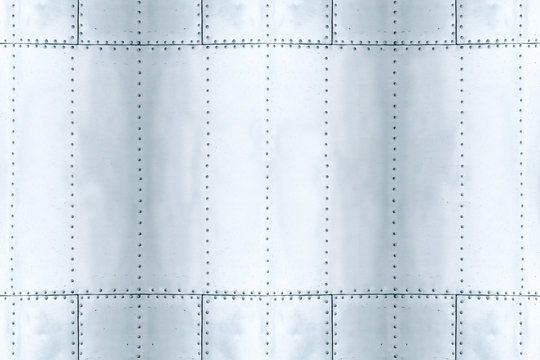 detail of old grunge piece of metal plate with bolts, aluminum surface background