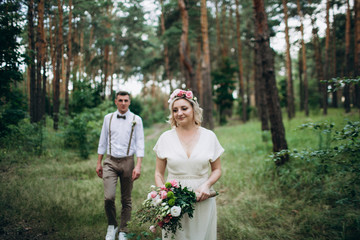 Beautiful wedding couple in a forest