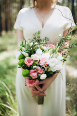 Beautiful wedding couple in a forest