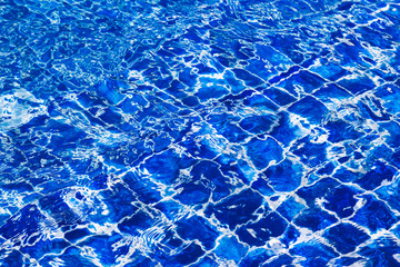 Blue color water in swimming pool rippled
