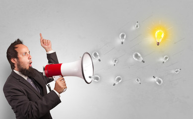 Person talking in megaphone with bulb, new idea concept