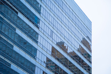 Blue glass windows of modern office building