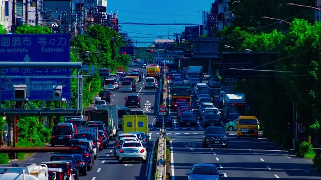 A timelapse of downtown street at Kanpachi avenue in Tokyo daytime long shot panning