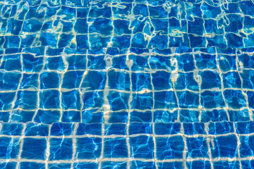 Blue color water in swimming pool rippled