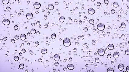 water or rain droplets on glass window. selective focus. narrow depth of field