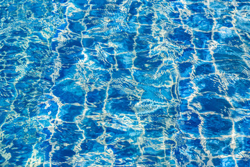 Blue color water in swimming pool rippled