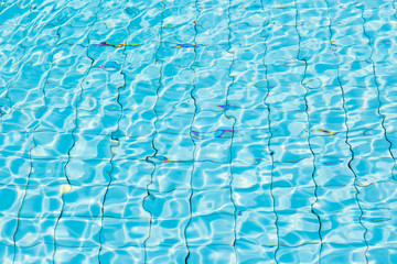 Water surface in blue swimming pool