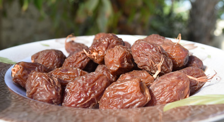 Fresh sweet dates fruit on plate