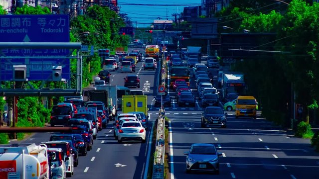 A timelapse of downtown street at Kanpachi avenue in Tokyo daytime long shot panning