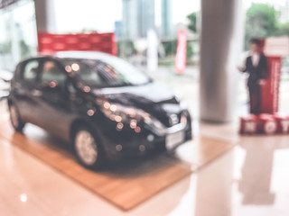 Blur image of car in the showroom