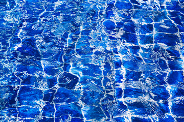Blue color water in swimming pool rippled