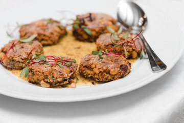 vegan gluten-free chops with beans, chickpeas and parsley, mustard sauce