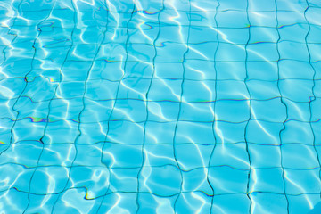 Water surface in blue swimming pool