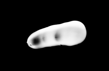 cosmetic cream isolated on a black background