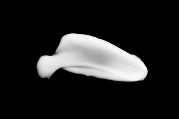cosmetic cream isolated on a black background