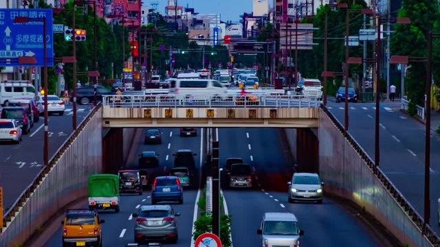 A timelapse of downtown street at Kanpachi avenue in Tokyo daytime long shot panning