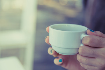 Woman drinking coffee in hand