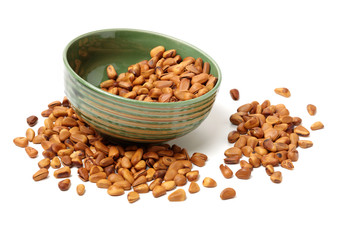 Pine nuts on white background