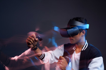 a man trying VR glasses, movement and blur photography technique second curtain flash
