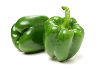 fresh green bell pepper (capsicum) on a white background