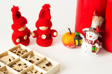 Christmas card with red candles, snowman and a set of Christmas toys