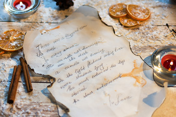 Fragment of an old handwritten letter on parchment. Winter atmosphere. Christmas time.