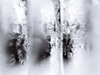 Abstract blurry wet misty glass monotone white and gray colour background