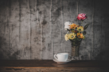 Still life with flower vases and coffee cups