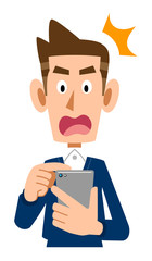 携帯電話を操作する驚いた表情の男性