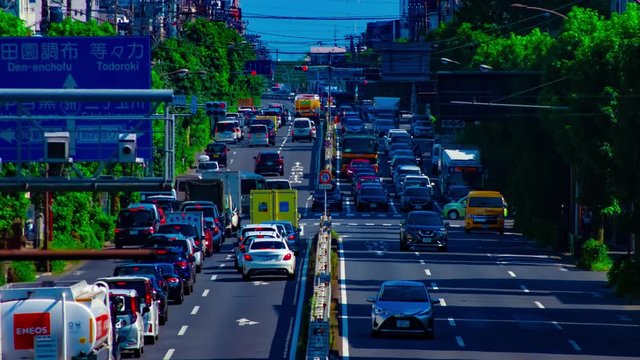 A timelapse of downtown street at Kanpachi avenue in Tokyo daytime long shot zoom